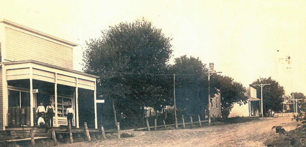 Hollenberg Street Shwing Community Well in Background